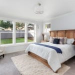 Beautiful master bedroom in new luxury home. Has large bank of windows